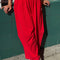 model wearing red draped relaxed fit pants