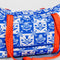 white and blue Scandinavian floral print with red strap and bow