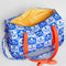 yellow gingham interior of white and blue Scandinavian floral print with red strap and bow