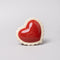 ceramic heart shaped trinket box with white scalloped trim and cursive 'everything' in the inside