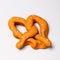 smooshed soft pretzel shaped de-stress ball with white heart shaped 'salt' on top