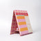 side view of colorful 'take notes this week' desk planner with stand