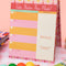 colorful 'take notes this week' desk planner with stand on a desk