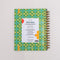 back view of green, blue and yellow plaid 12-month large planner with golden yellow elastic closure