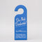 blue bookmark in the shape of a door hanger with white 'do not disturb!i'm currently lost in a fantasy world and i don't want to leave!' across the front