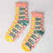 separated coral, teal, cream and yellow plaid chenille socks with coral ruffle top and cream grip bottoms