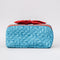 front view of blue quilted zipper makeup bag with red bow handle and all blue floral and bow print