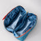 blue silky interior of blue quilted zipper makeup bag with red bow handle and all blue floral and bow print