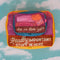 colorful packing cube set with various sayings on them stacked on top of each other on a blue cloud background