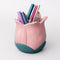 light pink tulip shaped pencil holder with pens inside