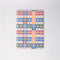notebook with muted pink, blue, yellow, cream and red plaid print
