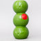 three green olives stacked vase