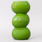 up close of three green olives stacked vase