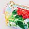 up close of colorful oil paint floral quilted pencil pouch
