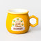 gold yellow mug that says 'locally sources wild flower honey' with honeycomb shaped handle