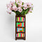 brown bookshelf vase with colorful book shelves with flowers inside
