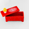 top view of red dress trinket box with yellow lamp and cat doily