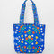 blue quilted tote with colorful folk print