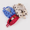 set of 3 3D zip set: red polka dot, blue polka dot, and cream with black polka dots with items inside