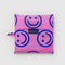 packaged hot pink big baggu with cobalt smiley faces