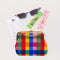 novelty bookmark set with green lip balm, rainbow gingham sunglasses and pouch, strawberry gum, and a receipt for a cat cafe