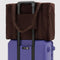 rich brown cloud carry-on on a suitcase