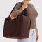 model carrying rich brown cloud carry-on