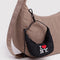 black crescent bag charm with 'I LOVE NY' on a bag