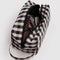 black and white gingham dopp kit with items inside