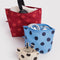 set of 3 polka dot go pouch set: cream with black dots, blue with dark blue dots and red with bright red dots with items inside