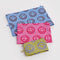 flattened set of 3 go pouch set: small yellow with periwinkle smiley, medium hot pink with bright smiley, and large light blue with brown smiley