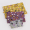 flattened set of 3 wildwood go pouch set: grey floral, plum floral, and yellow floral