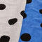 up close of set of two polka dot hand towels: blue with black dots, and cream with black polka dots