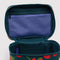 up close of dark green cosmetic case with all over strawberry print