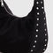 side view of black medium crescent bag with silver studs