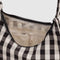 cream interior of black and white gingham with mini nylon shoulder bag