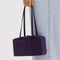 model holding fig (deep purple) nylon bowler bag