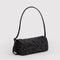 side view of charcoal nylon loaf bag with black ditsy floral print