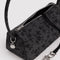 interior of charcoal nylon loaf bag with black ditsy floral print