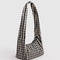 side view of black and white gingham meringue bag