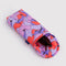 sunglasses inside of purple, pink and orange puffy glasses sleeve with purple dolphin print