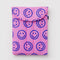 pink 13" puffy laptop sleeve with blue smiley print