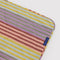 up close of colorful gradient stripe puffy picnic blanket