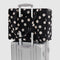 black and white polka dot small cloud carry on bag attached to a silver suitcase