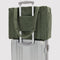 muted olive green small cloud carry-on bag on a suitcase