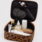 interior of leopard print small cosmetic bag with items inside