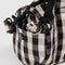 up close of key leash on black and white gingham small duffle bag