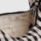 cream interior of black and white gingham small meringue bag