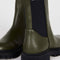 up close of black elastic on hunter green chunky sole boots