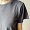 up close of model wearing relaxed fit carbon grey cotton tee